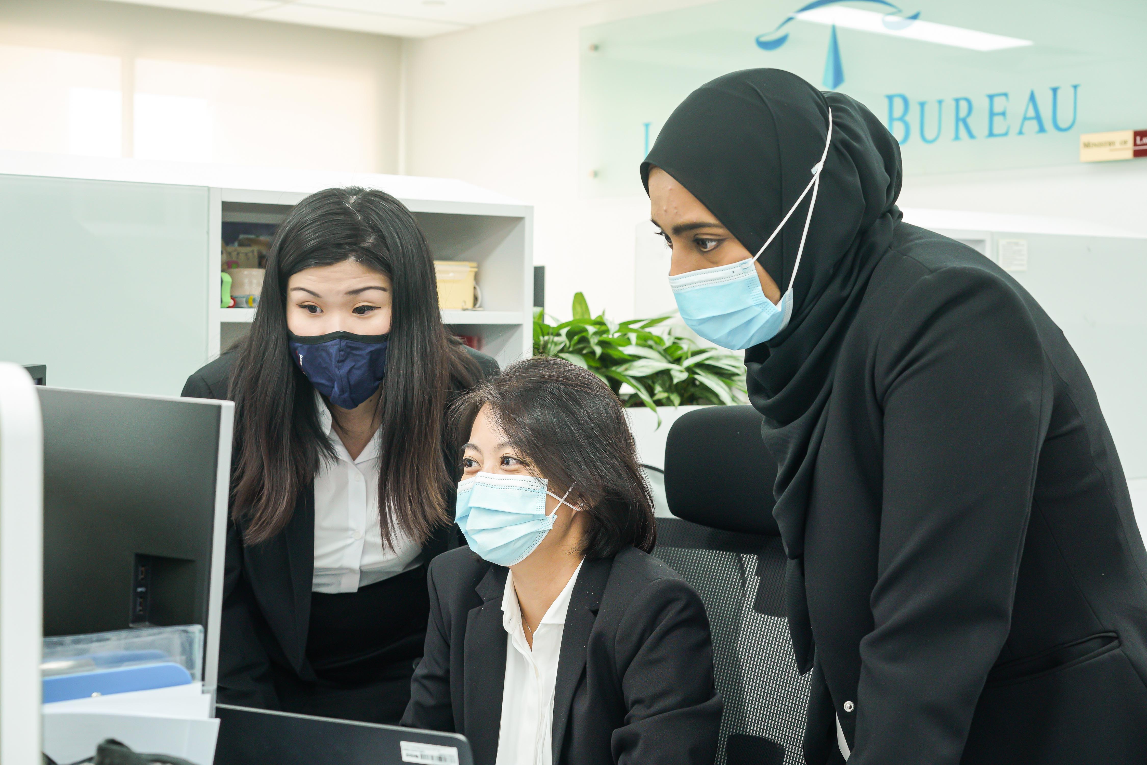 From left: Rae-Anne, Xin Hui, and Latifah having a discussion